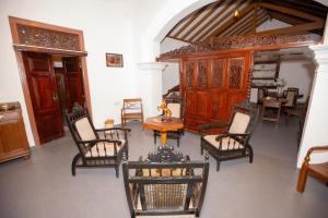 a group of chairs and a table in a room at Cinnamon Legacy in Weligama