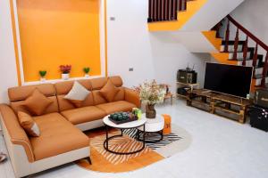 a living room with a couch and a table at Mocha Vila Mộc Châu in Mộc Châu