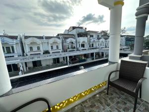 a balcony with a view of a building at Inn Dulgence in Patong Beach