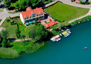 an aerial view of a house on an island in the water at Hotel Barlinek in Barlinek