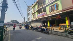 a group of motorcycles parked on the side of a street at Hotel Rani mahal Biratnagar in Biratnagar
