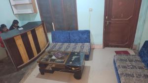 a living room with a couch and a table at Hotel Rani mahal Biratnagar in Biratnagar
