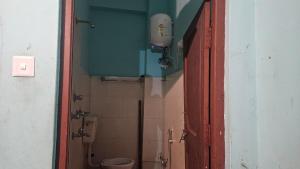 a bathroom with a shower and a toilet in a stall at Hotel Rani mahal Biratnagar in Biratnagar