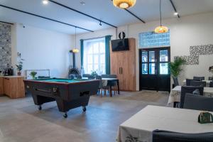 a large room with a pool table in it at Penzion u Karla in Jamolice