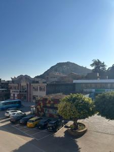 a parking lot with a bunch of cars parked at Travel Island B&B in Beigan