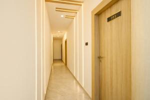 a hallway with a sign on the side of a building at FabHotel Lake View Castle in Warangal +33 photos
