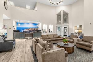 a large living room with couches and a table at La Quinta by Wyndham Newport in Newport