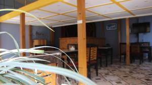 a dining room with a table and chairs and a ceiling at Bhuwani Himalayan Height Hotel in Kathmandu