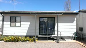 a house with a porch with a glass door at Oval Motel - Murray Bridge in Murray Bridge