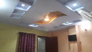 a room with a ceiling with a light on it at Ayub Residence Bhurban in Murree +33 photos