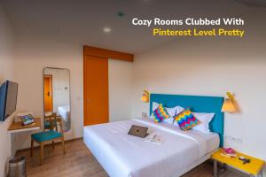 a bedroom with a bed with a laptop on it at goSTOPS Bengaluru, Jayanagar - Private Rooms & Dorms in Bangalore