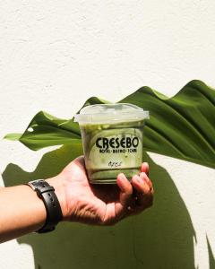 a person holding up a container of pasta pudding at Cresebo Mansion in Tagbilaran City +11 photos
