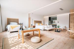 a bedroom with a bed and a living room at Xianzai Houshe Boutique Hotel in Dujiangyan +130 photos