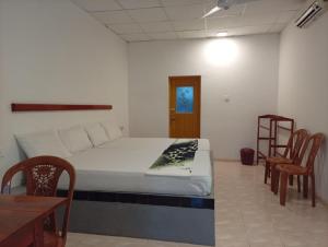 a bedroom with a bed and a table and chairs at Zendora Resort Yala in Tissamaharama +27 photos