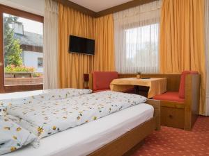 A bed or beds in a room at Haus Elisabeth