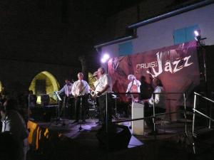a group of people on a stage at night at La Grange de la Lavande in Lardiers
