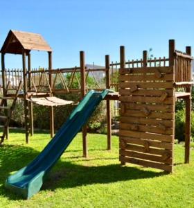 a playground with a slide and a gazebo at Hill Fore! in Langebaan