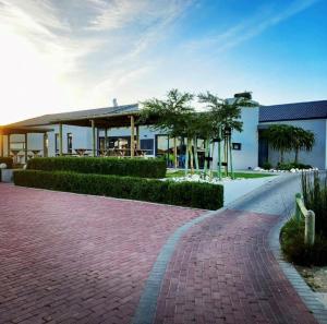 a brick road in front of a building at Hill Fore! in Langebaan