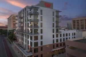 a tall white building on a city street at Hampton Inn and Suites Austin University Capitol in Austin