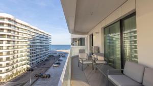 a balcony of a hotel with a view of the ocean at Velora Apartments in Năvodari