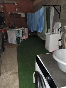 a room with a green floor and a sink at Le Chaumois, CHAUM 31440 in Chaum +15 photos