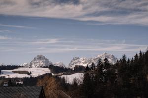 a view of a mountain range with snow at Alpenblick Gösweiner in Windischgarsten