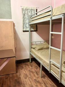 a bunk bed room with two bunk beds at Shillong Backpackers Hostel in Shillong