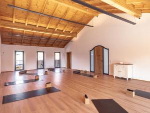 an empty room with yoga mats on the floor at Sailerhof Gramminger in Taching am See