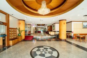 a large lobby with a chandelier in a building at Summit Pavilion Hotel in Bangkok +124 photos