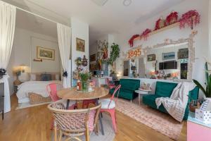 a living room with a couch and a table at Casa 1895 , Boutique Stay in a Historic Townhouse near the Beer Fountain in Žalec
