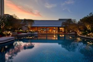 a large swimming pool in front of a building at PARKROYAL Serviced Suites Singapore in Singapore