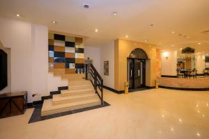 a hallway with a staircase in a building at Cleopatra Hotel in Aswan