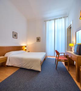Postel nebo postele na pokoji v ubytování Hotel Monte Carlo