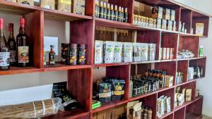 a shelf filled with lots of bottles of alcohol at katunayake city apartment in Katunayaka
