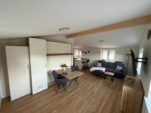 a living room with a couch and a table at Ferienwohnung Theus in Albersdorf