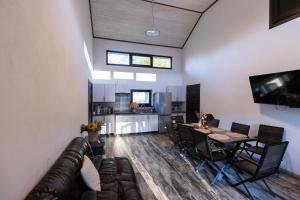 a living room with a couch and a table with chairs at Shatiz in Izki