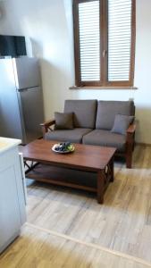 a living room with a couch and a coffee table at Apartment on Tabukashvili Street in Tbilisi City