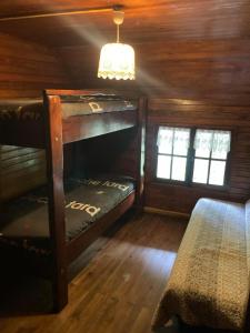 a room with a bunk bed in a cabin at Refuge-style chalet Mountain view in Colmars