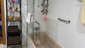 a bathroom with a shower and a bath tub at CHESA RUISA in Castro Marim +44 photos