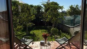 a view of a patio with chairs and a table at CHESA RUISA in Castro Marim
