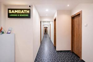 a hallway with a sign that reads sandwich closing and borrowing at FabHotel Samrath in Mumbai +30 photos