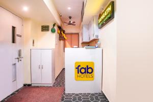 a room with a fico holds sign on a wall at FabHotel Samrath in Mumbai