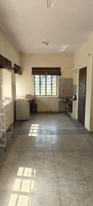 an empty room with a kitchen and a large window at Dalpat singh in Jaipur