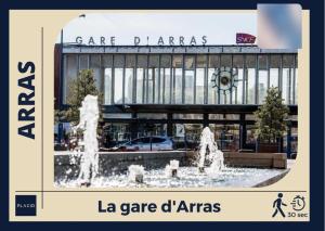 a picture of a fountain in front of a building at L'Héloïse, studio à Arras en résidence sécurisée in Arras +3 photos