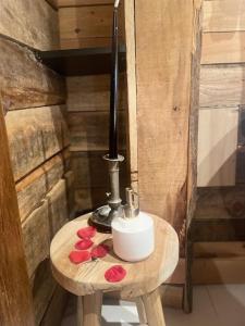 a small wooden table with a soap dispenser and flowers at Chassepierre's Soul in Chassepierre +28 photos