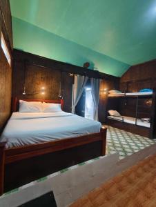 a bedroom with a large bed in a room at The love shack atChaba in Ko Lanta