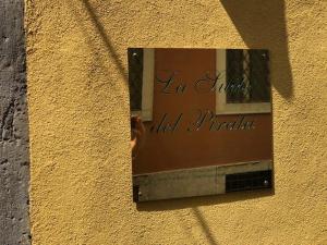a mirror on the side of a building with the words la union old principal at Suite del Pirata in Gargnano