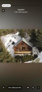 a picture of a house in the snow at Chalet cocody jacuzz in Jausiers
