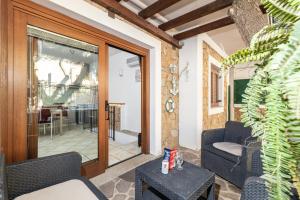 a living room with a couch and a table at Casa Ale in centro in Santa Maria Navarrese