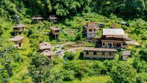 an aerial view of a village with houses on a hill at Art Mile Kalimpong in Kalimpong